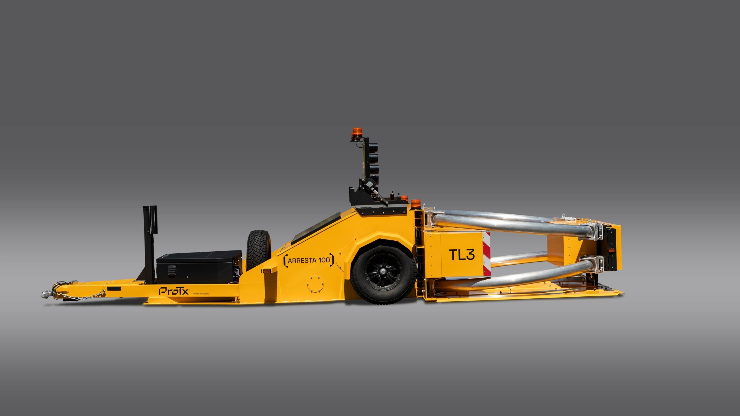 A yellow ProTec TL-3 highway crash cushion trailer with wheels, safety bars, and a black towing attachment, displayed against a gray background.